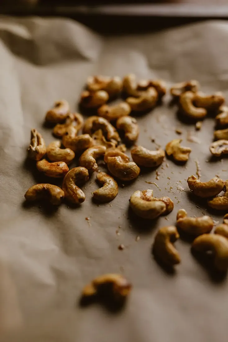 Walnut-like nut kernels scattered on a light surface
