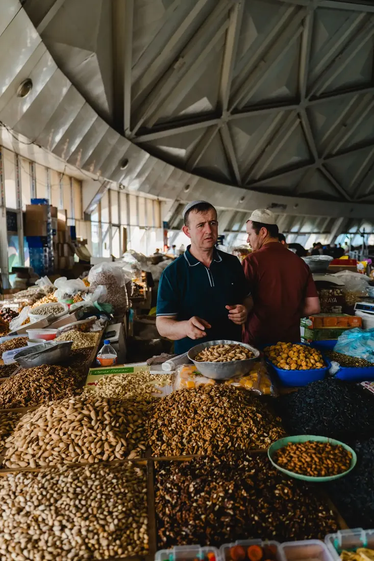 Hands sorting nuts during small-batch selection
