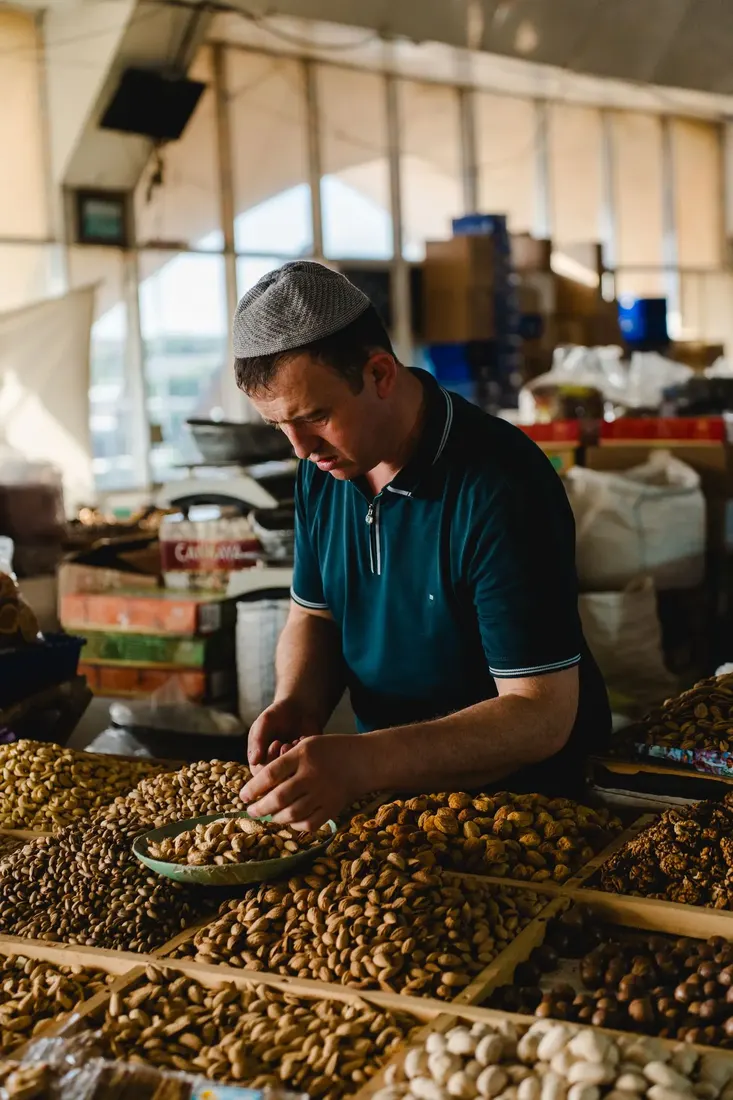 Producer inspecting a nut harvest by hand
