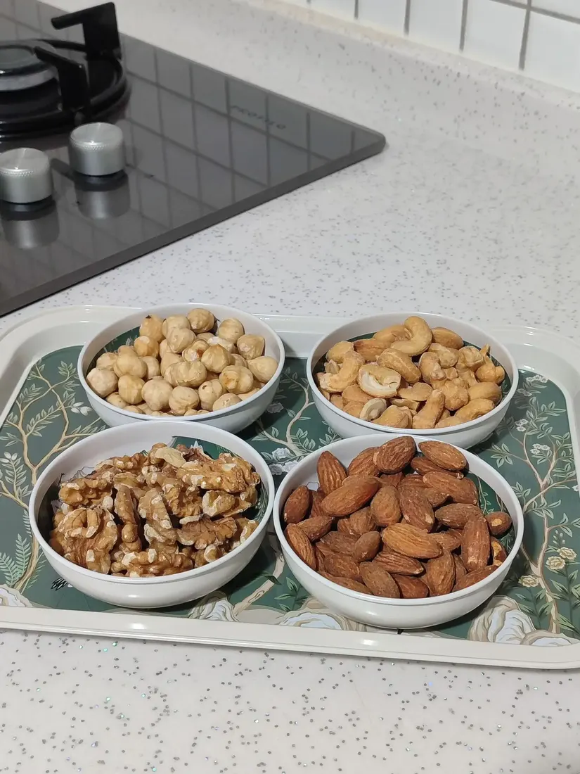 Several bowls of nuts ready for roasting and tasting